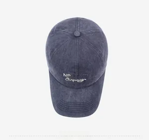 Macro detail of navy washed cotton baseball cap with white NEW YORK embroidery
