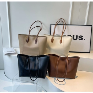 Tote bags in black, dark brown, khaki, and cream shown on minimalist display