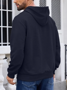 Rear view of navy blue men hoodie featuring intricate geometric jacquard fabric texture