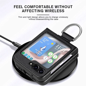 Detail of black leather texture phone case on wireless charger with ring holder
