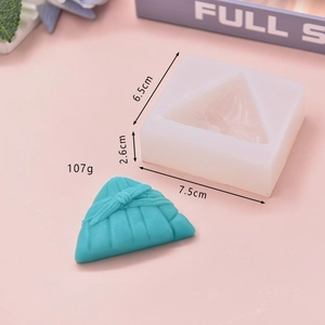 Macro view of 7.5x6.5cm zongzi silicone mold with detailed texture and finished cake