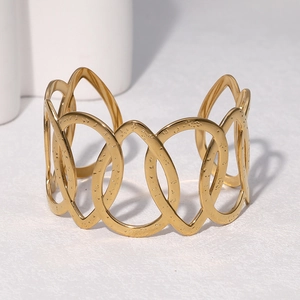 Classic gold hammered hollow cuff bracelet with interlocking oval shapes in 18k gold finish