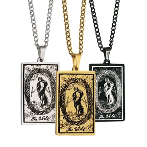 Three tarot The World rectangle pendants in gold, silver and black with curb chains