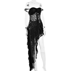 Detail of black lace dress showing sheer texture, off-shoulder cut and irregular hemline