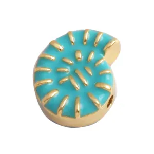 Detailed view of a gold-plated shell pendant with vibrant turquoise enamel inlay