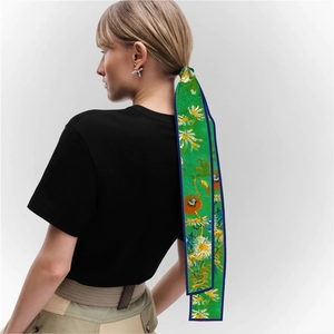 Detail of oil painting sunflower silk ribbon tied as a hair accessory on a ponytail