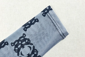 Close-up of mesh fabric with abstract pattern showing high-quality stitching detail