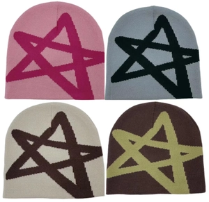 Close-up of four knitted beanies featuring large star patterns in multiple color options