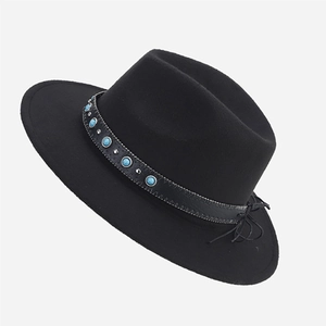 Detail of black wool fedora with leather band, turquoise beads and metallic studs