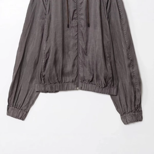Minimalist dark grey hooded bomber jacket with adjustable drawstring and sleek metal zipper