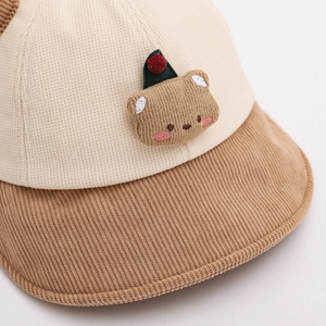 Corduroy children bucket hat featuring a cute bear patch and contrast stitching