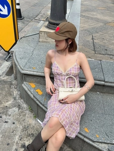 Detail of purple and brown plaid summer set with backless top and ruffled skirt