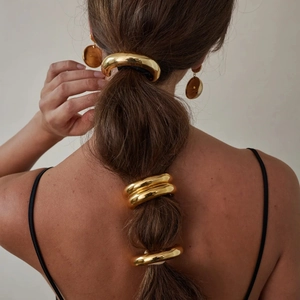 Elegant gold metallic hair accessories and circular earrings set for minimalist women's style