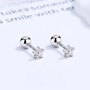 Macro view of S925 silver star stud earrings with cubic zirconia and screw back