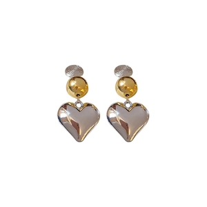 Elegant two-tone heart drop earrings featuring silver textured disks and gold beads