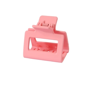 Macro detail of a 5cm matte pink square hair claw clip with a premium frosted finish