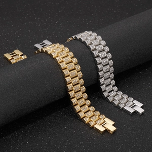 Close-up of gold and silver hip hop tank chain bracelets with iced-out pave crystals