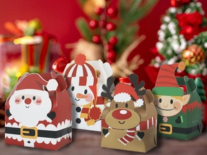 Detailed view of four festive Christmas gift boxes with Santa, snowman and reindeer designs
