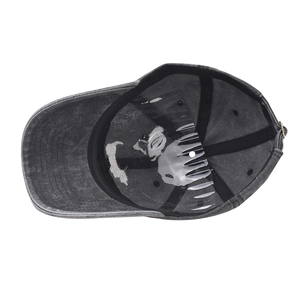Detail of washed cotton baseball cap interior with adjustable metal strap and hat support