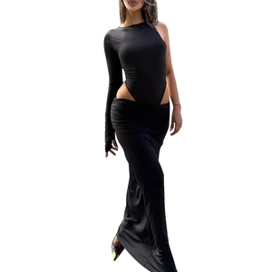 Detail of black one-shoulder cutout bodysuit and high-waist maxi skirt set for women
