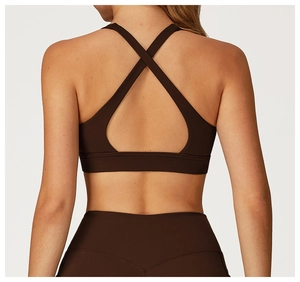 Detail of cross-back strap design on dark brown high-elastic sports yoga bra