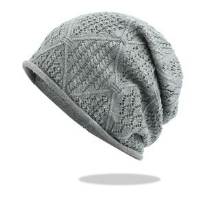 Hollow knit slouchy beanie in grey featuring breathable geometric weave patterns