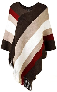 Detailed view of colorful striped knit poncho with fringe trim and soft wool texture