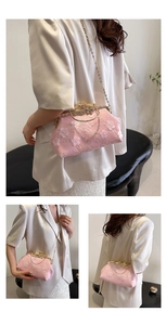 Detailed view of pink mesh shell bag with floral lace embroidery and golden metal clasp