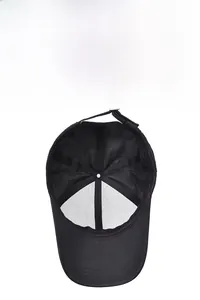Detail of the breathable mesh interior and adjustable metal buckle on a black baseball cap