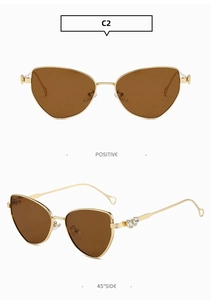 Front and side view of gold metal cat-eye sunglasses with brown lenses and detail