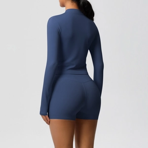 Rear view of deep blue slim-fit yoga set showing brushed texture fabric and body shaping