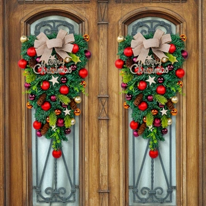 Christmas teardrop wreath for door with red bows, gold baubles and pine cones