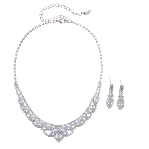 Elegant silver-toned necklace and earrings set with teardrop rhinestone floral design