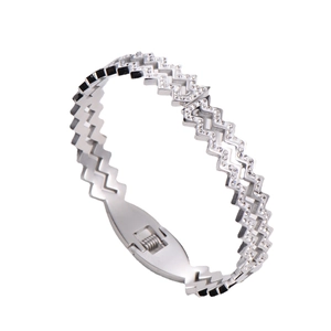 Silver geometric zigzag bangle with sparkling crystals and polished metal finish