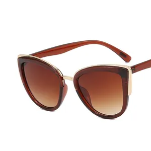Vintage oversized cat-eye sunglasses with brown gradient lenses and gold metal trim