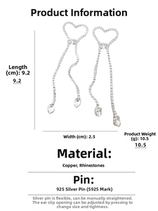 Vue détaillée montrant la longueur de 9,2 cm des boucles d'oreilles cœur à pompon