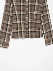 Close-up of the coffee plaid pattern on slim fit long sleeve button-up shirt fabric