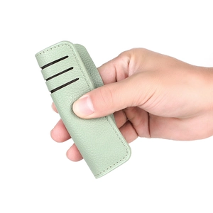 Slim mint green lychee pattern leather card holder with three card slots and fine stitching