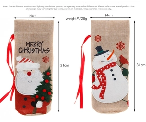 Detail view of 31x14cm burlap Christmas wine bottle bags with Santa and Snowman embroidery