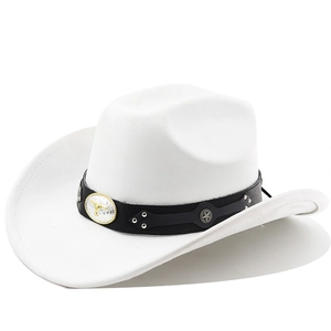 Detail of white suede cowboy hat featuring bull skull metal emblem and silver star rivets