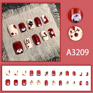 Unghie finte corte festive con gatto cartoon e cachi, set da 24 pezzi in rosso e nero