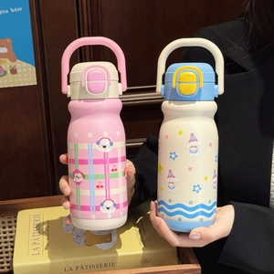 Detail of portable stainless steel thermos bottles with cute polar bear and dog patterns