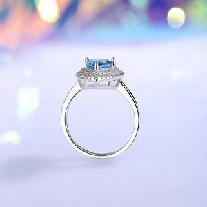 Elegant S925 silver ring featuring a blue heart-shaped gemstone with double halo diamonds