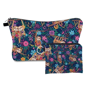 Set of two navy blue polyester cosmetic bags with cute sloth and floral cartoon prints