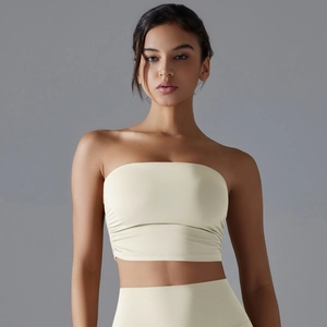 Detail of light beige ruched tube top yoga bra featuring high-elasticity breathable fabric