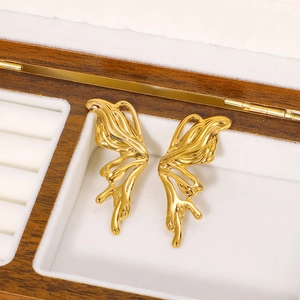Minimalist 18k gold plated stainless steel butterfly wing earrings in a wooden jewelry box