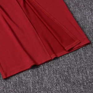Detailed close-up showing the precise stitching and hemline of the red slim-fit maxi dress