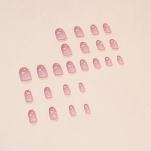 Pink gradient oval press-on nails set with glitter hearts and star patterns