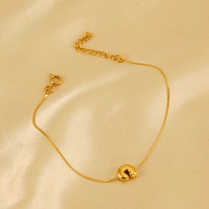 Minimalist 18K gold plated stainless steel chunky bracelet on elegant satin background