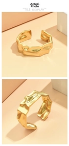 Detail view of the hammered golden stainless steel ring with irregular wavy texture